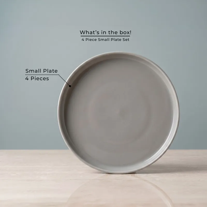 Single grey round quarter plate shown front on against a plain backdrop