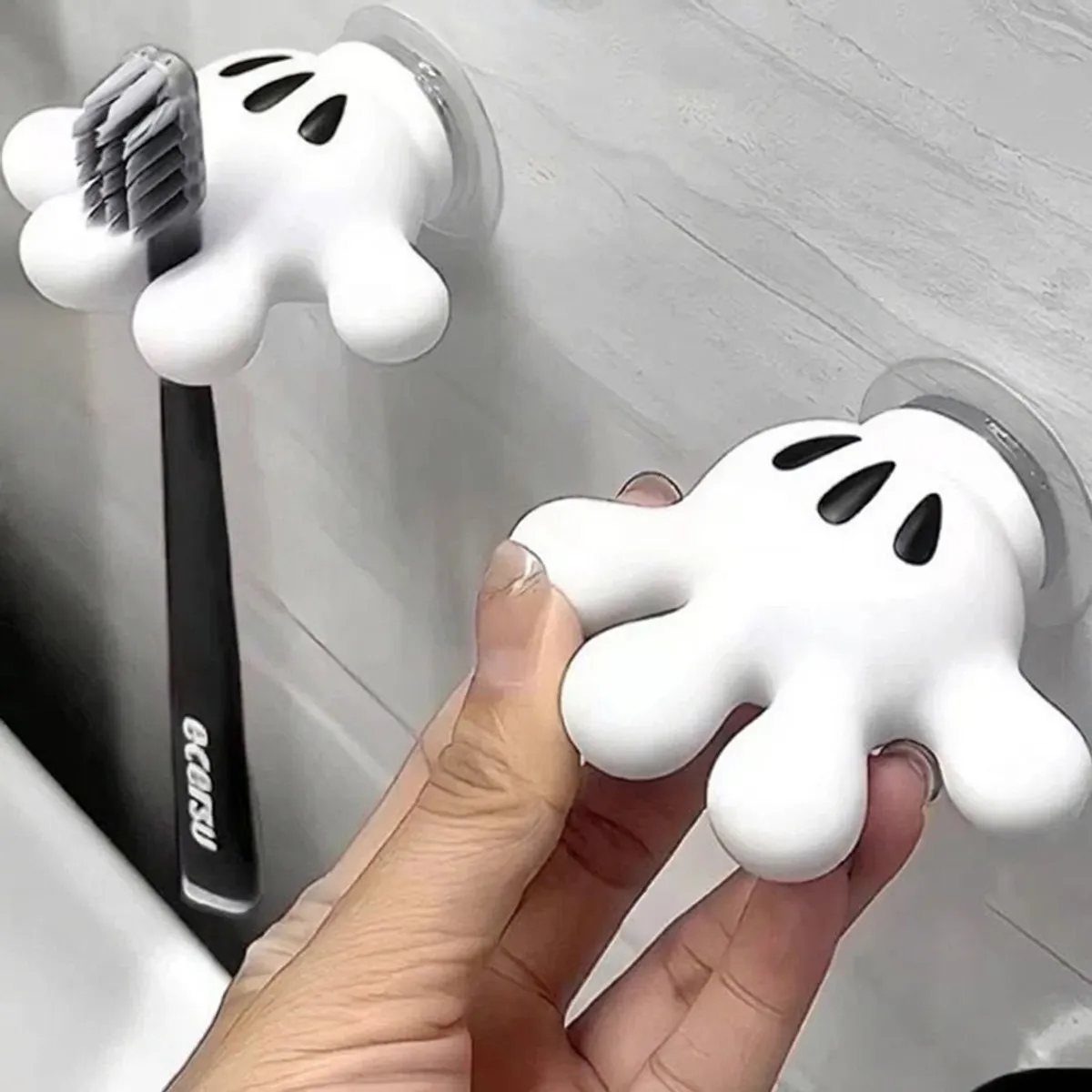 Close-up of white free-form wall hooks with suction backing