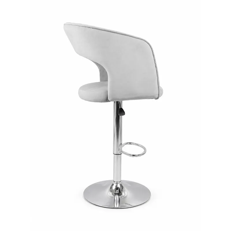 Side view of grey velvet bar chair with curved back and chrome base