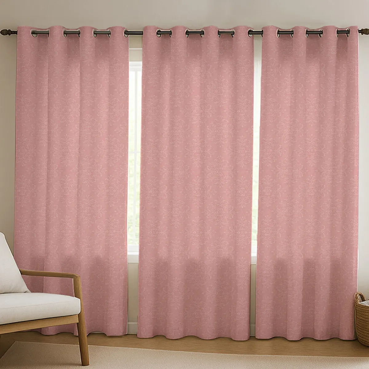 Pink patterned curtains hanging across a window