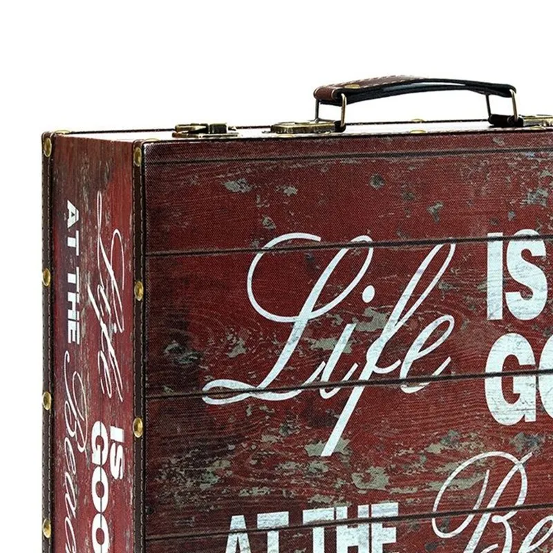 Close-up of the distressed brown storage box with white lettering and handle