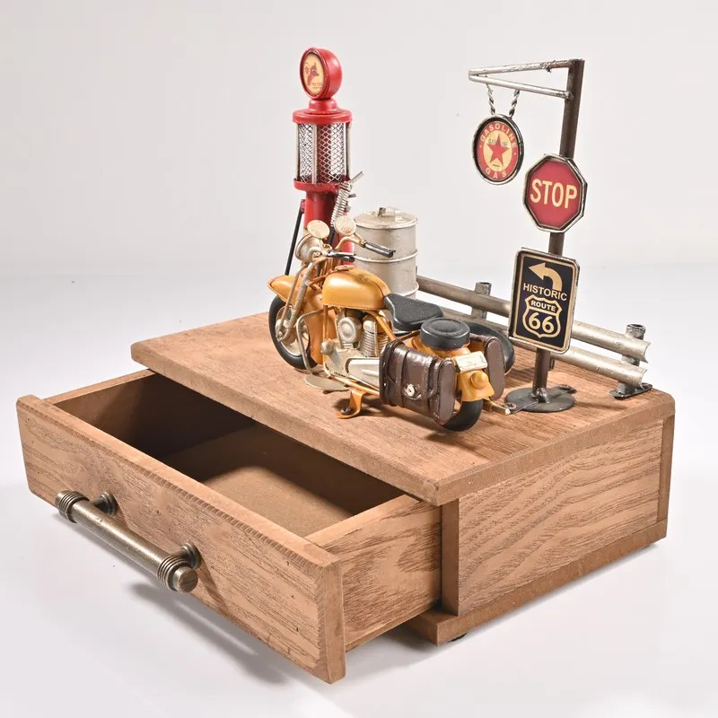 Open wooden storage box with vintage motorcycle and petrol station accents
