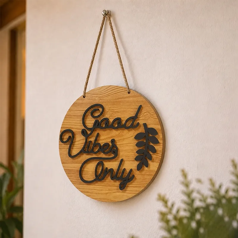 Good Vibes Only round wall accent hanging against a neutral wall