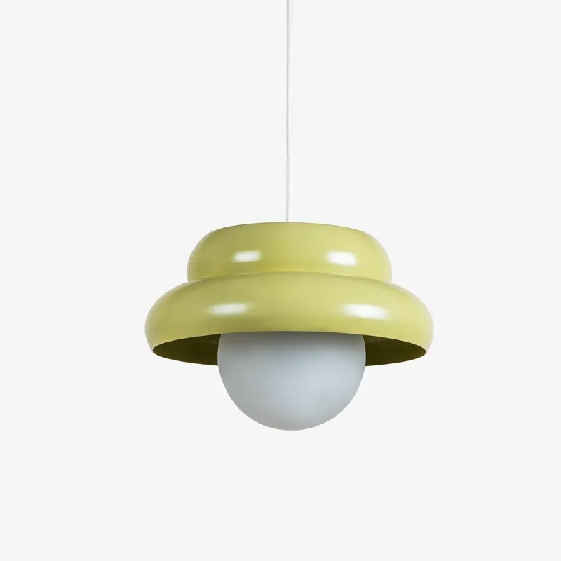Angled view of pistachio green round ceiling lamp with white globe shade