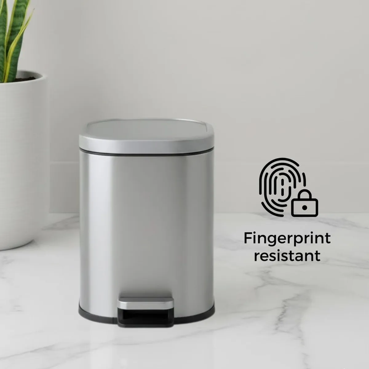 Closed grey metal pedal dustbin with smooth modern finish
