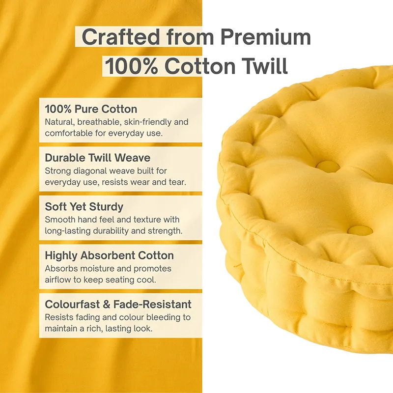 Close view of a round mustard yellow floor cushion