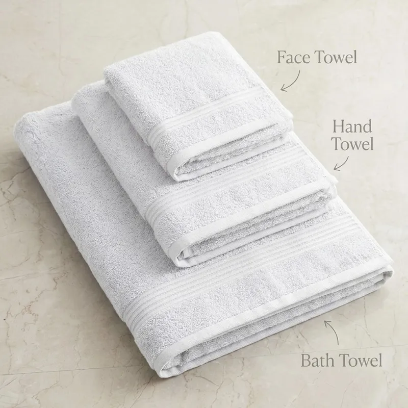 Stack of three white towels in different sizes