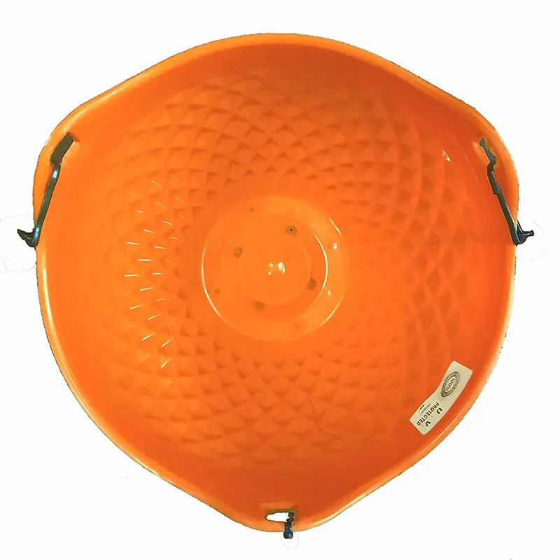 Top view of an orange hanging planter with textured interior