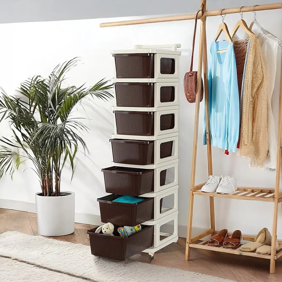 Seven-tier white and brown drawer rack with open drawers beside a clothes rack