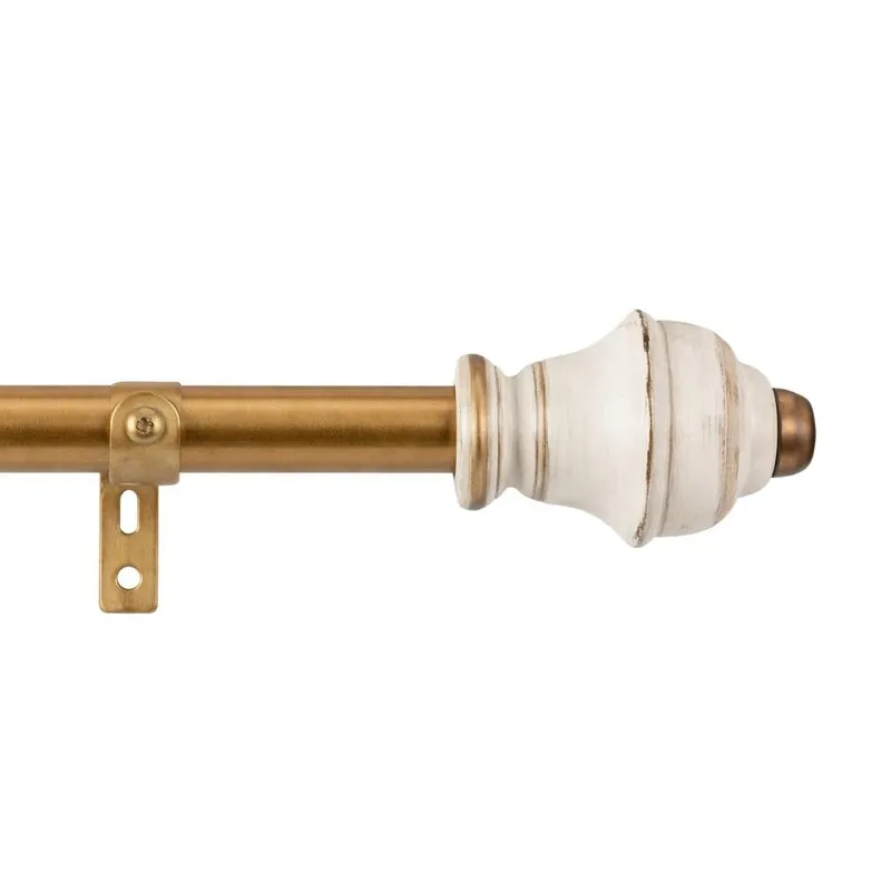 Side view of curtain rod showing white decorative finial and bracket