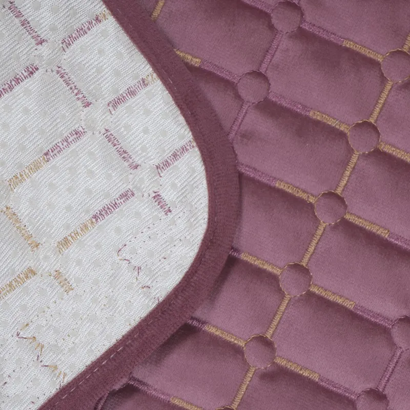 Close-up showing the wine-purple cover's patterned top and pale backing