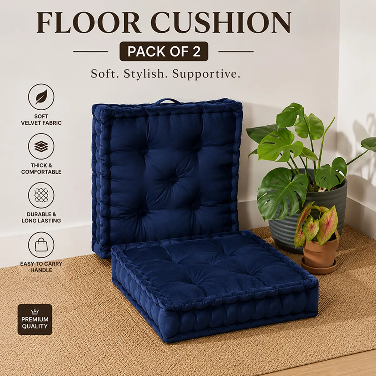 Two navy blue velvet floor cushions with tufted surfaces and carry handles.