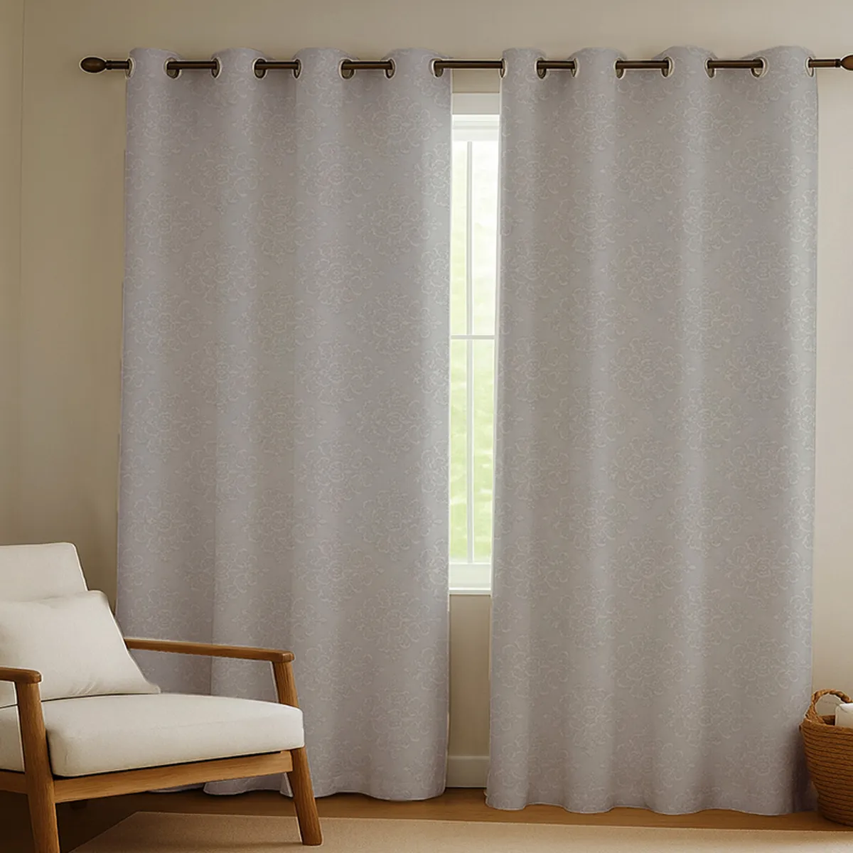 Grey eyelet curtains with all-over damask-style pattern by a window