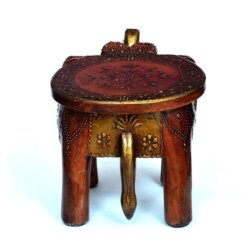 Back view of brown carved wooden stool with round seat