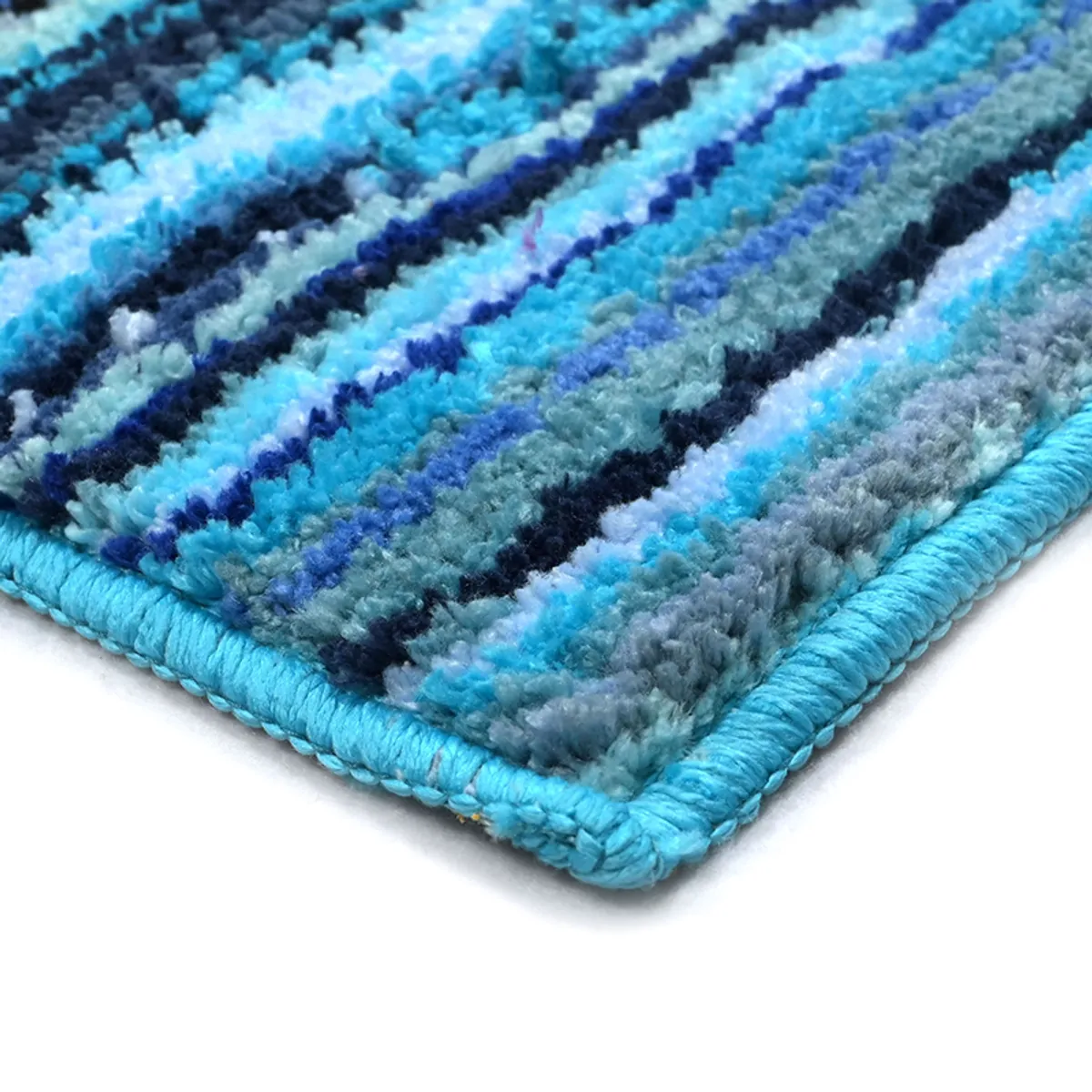 Detailed corner view of the blue striped carpet with a finished edge