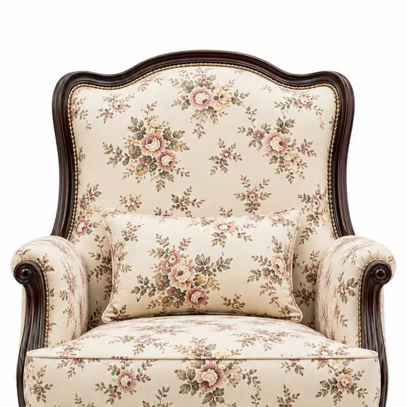 Close view of chair back, arms and cushion with floral upholstery