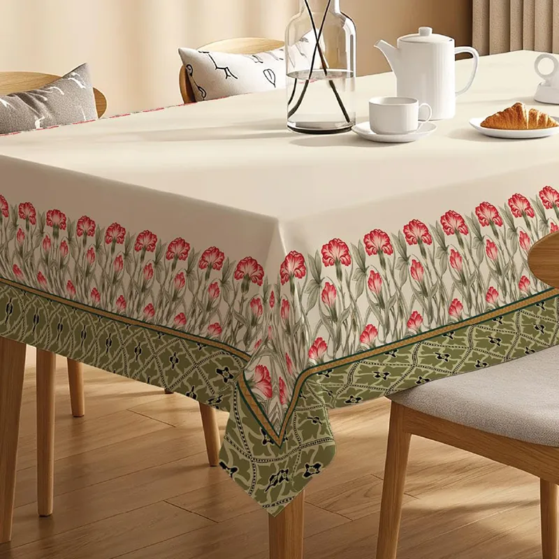 Rectangular table cover with floral border styling on a dining table