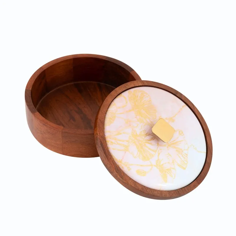 Open round wooden masala box with its floral lid placed beside it
