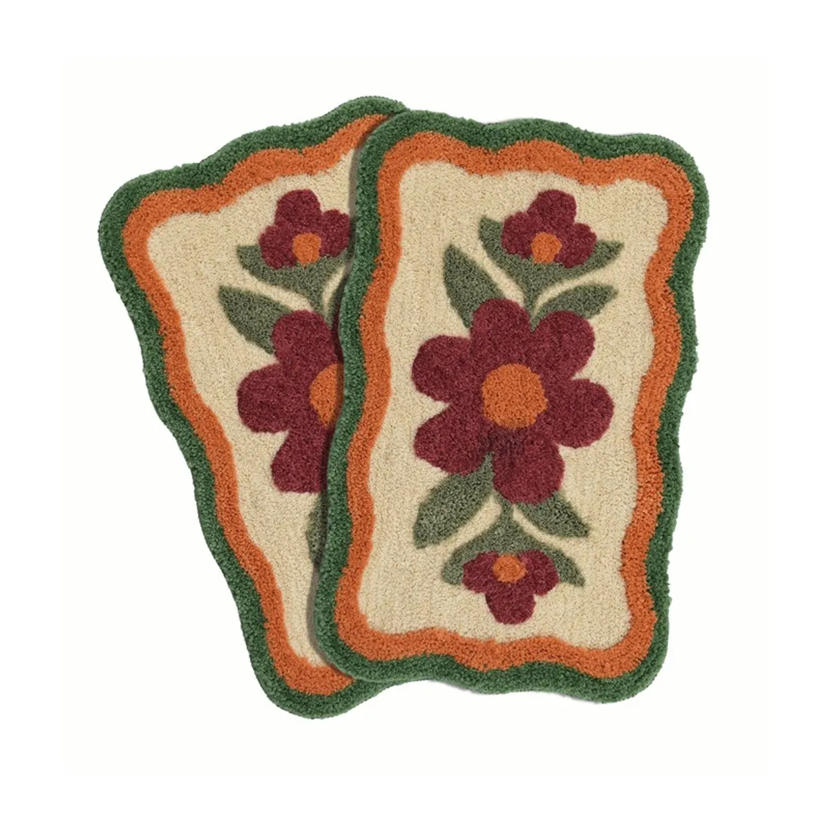 Set of two scalloped floral bath mats in rust, beige and green