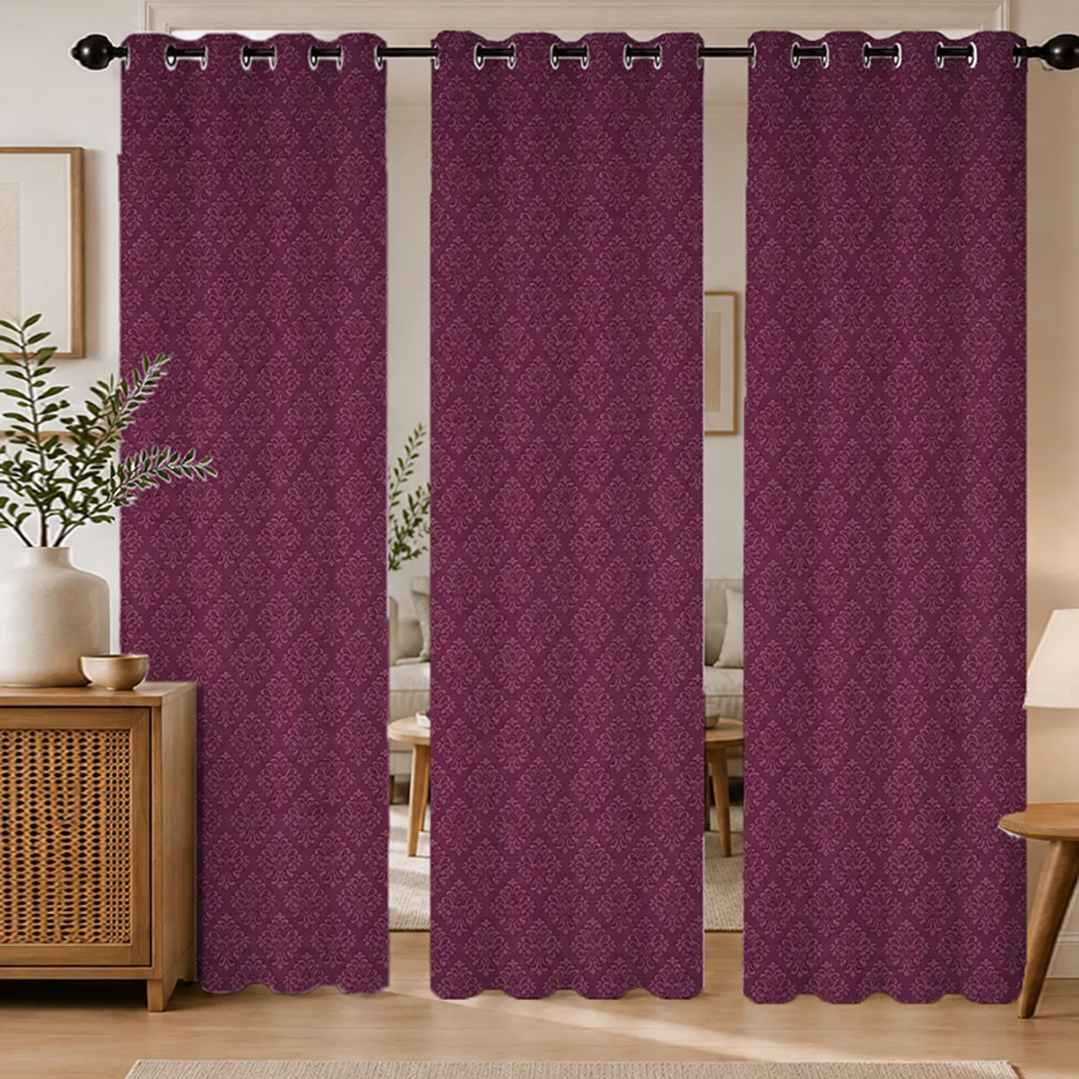 Three maroon damask curtains styled in a warm living room