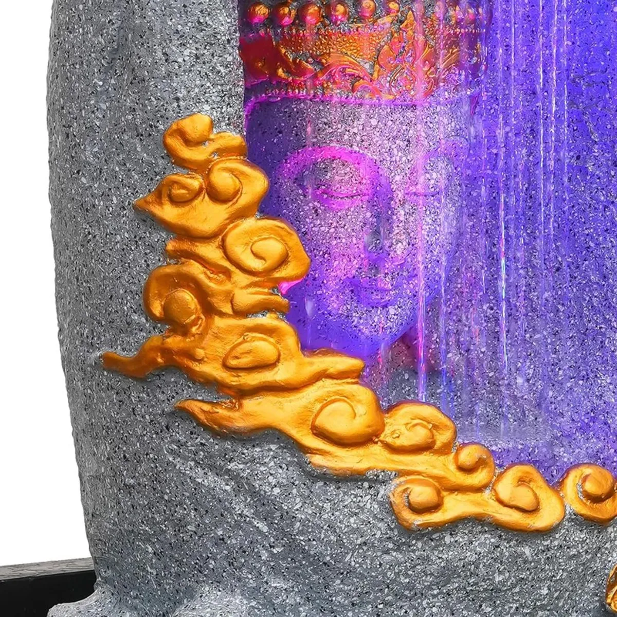 Close-up of gold decorative accent on grey Buddha fountain