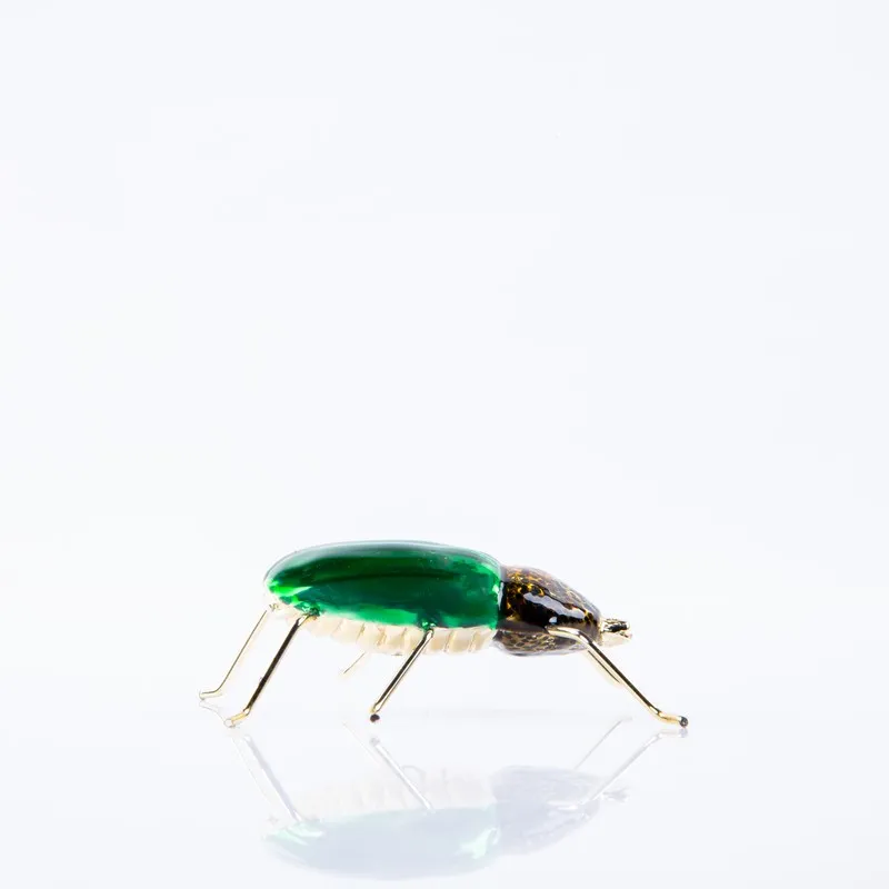 Opposite side view of green enamel dung beetle showpiece