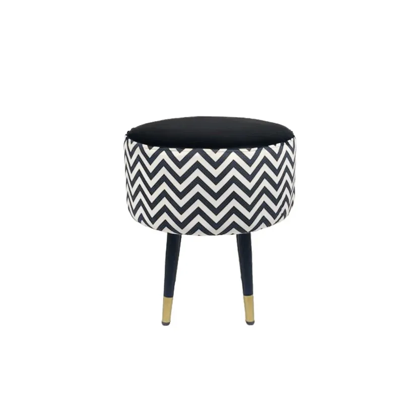 Round ottoman shown against a white background