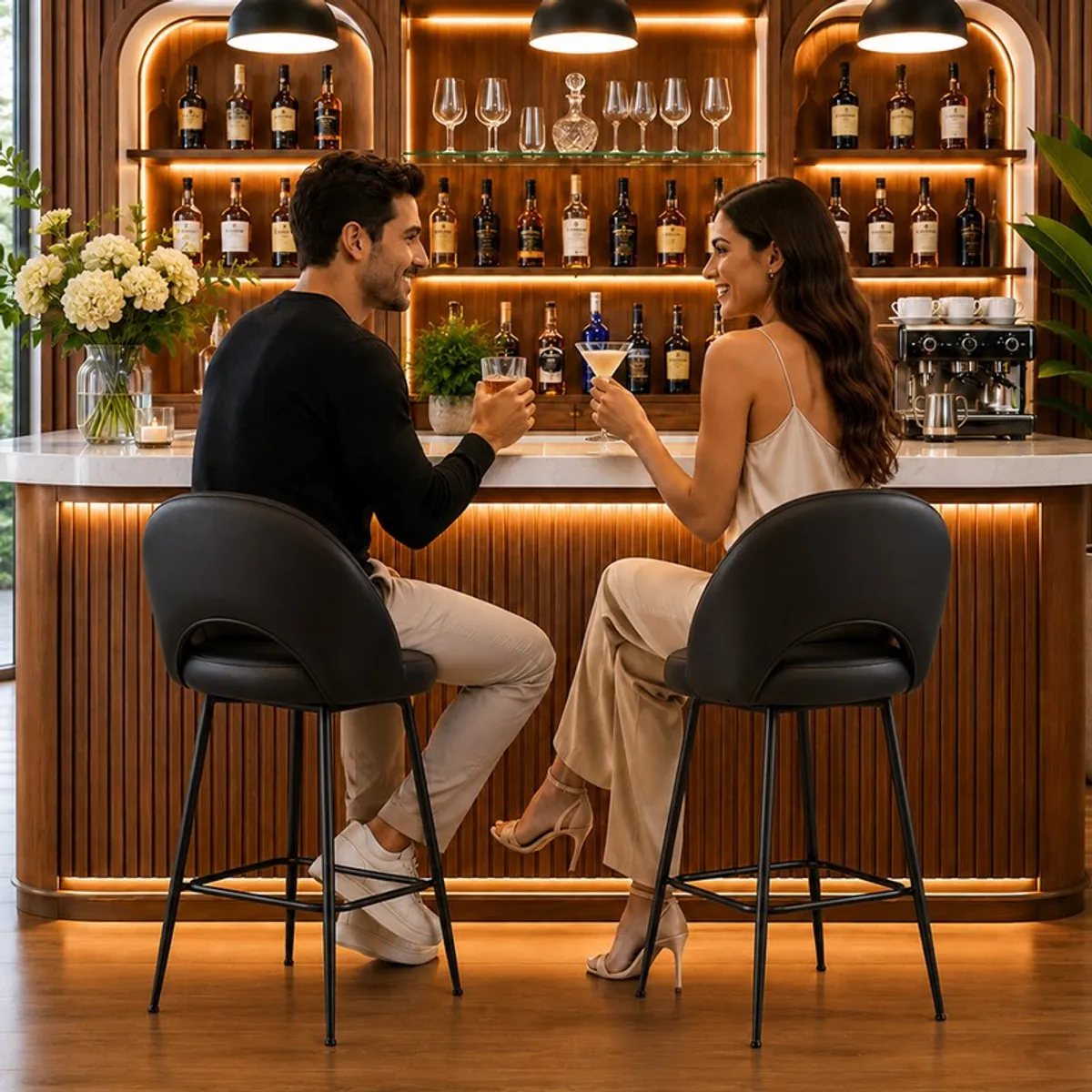 Two black bar chairs arranged at a warm contemporary home bar