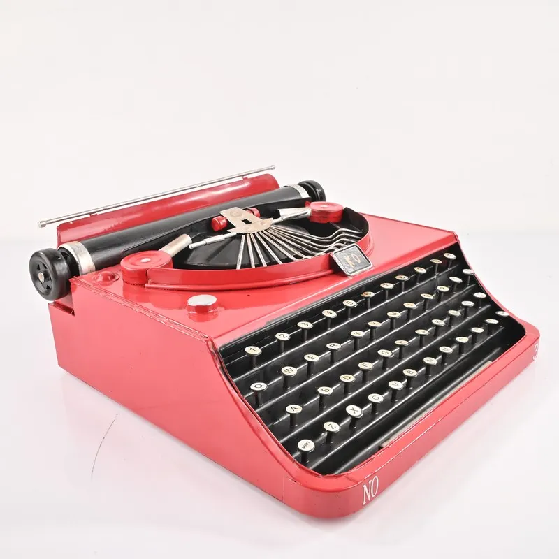 Angled view of the red and black iron typewriter showpiece