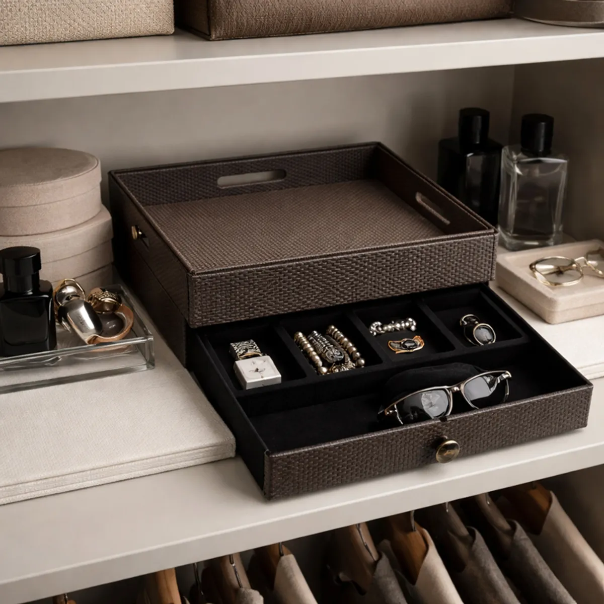 Brown-black organiser displaying jewellery and glasses on a wardrobe shelf