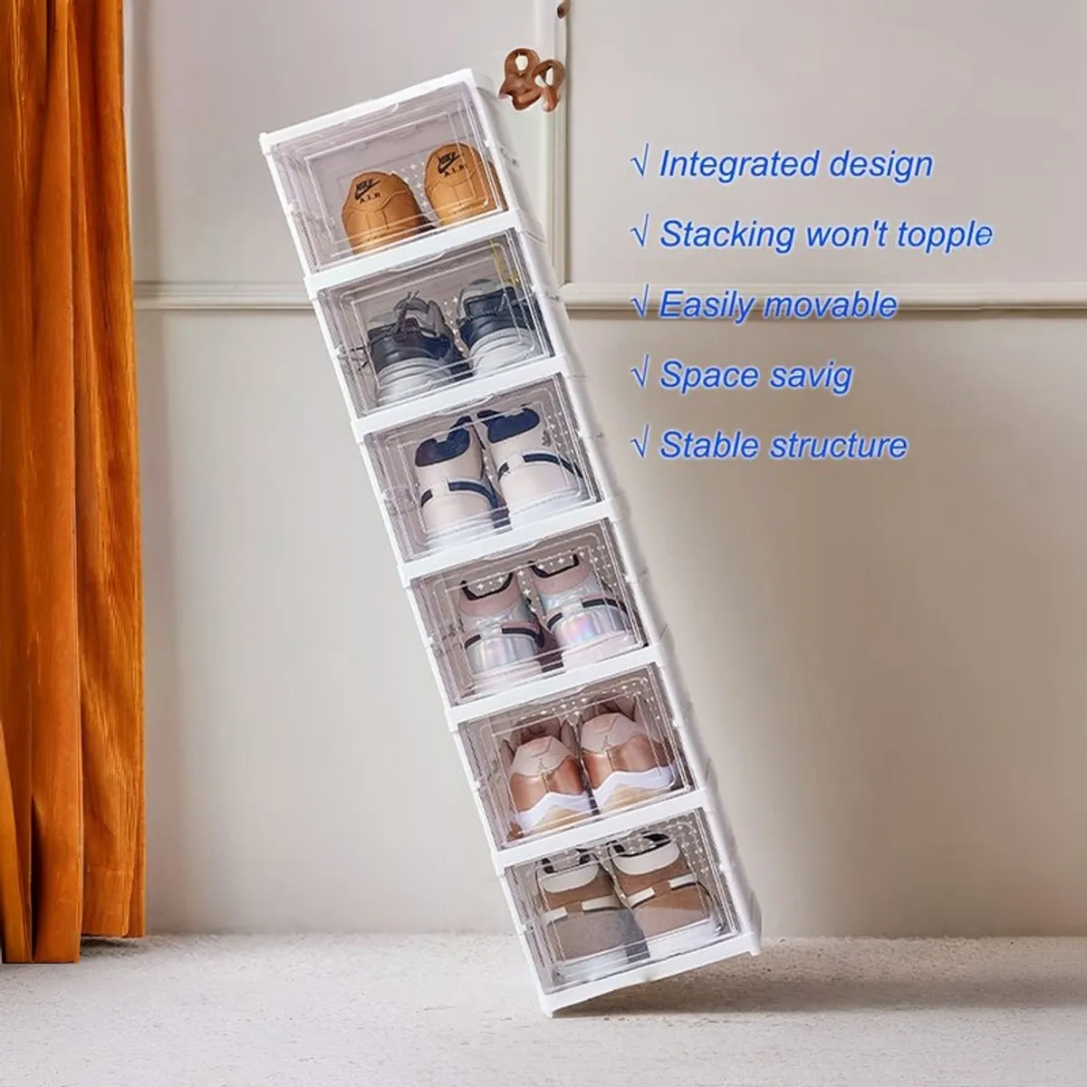 White shoe rack shown leaning with footwear in transparent compartments