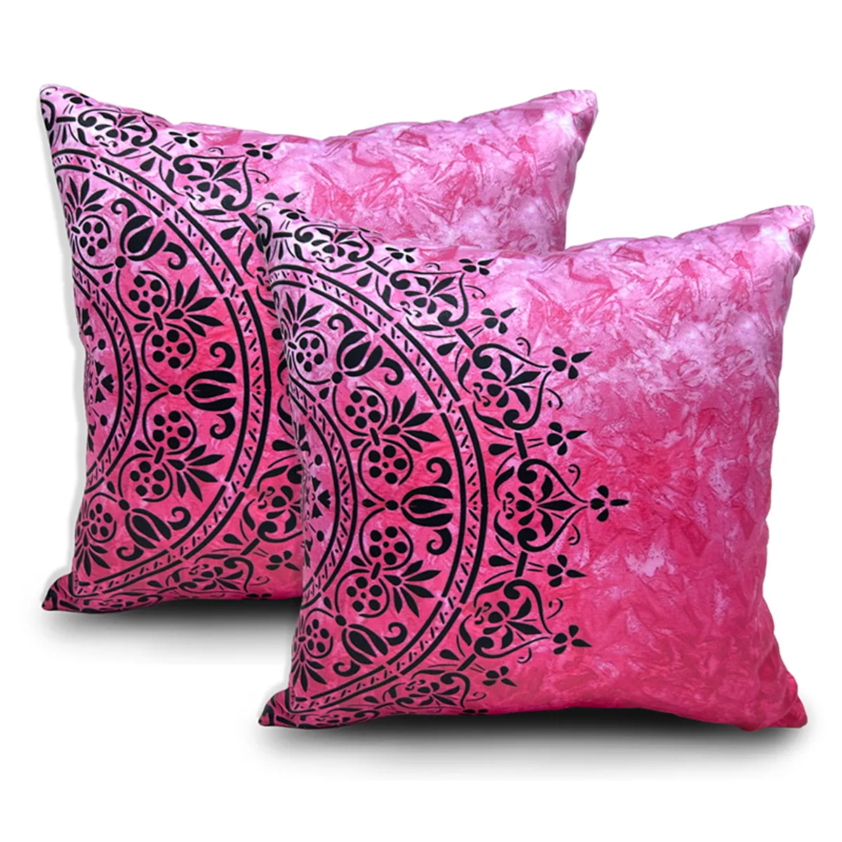 Two bright pink square cushion covers with black ornate prints displayed against a white background