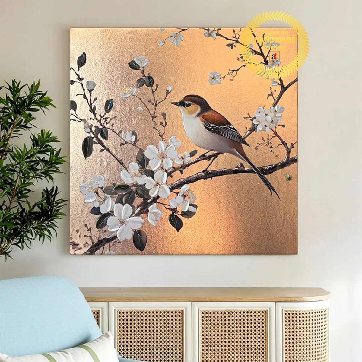 Bird and blossom canvas wall art displayed above a woven console