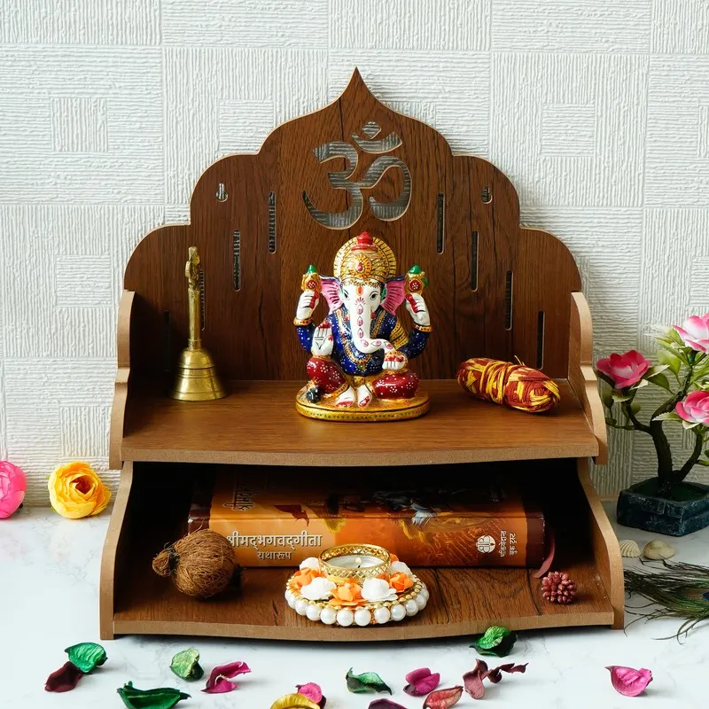Front view of brown wooden mandir with Om cutout and open shelf design
