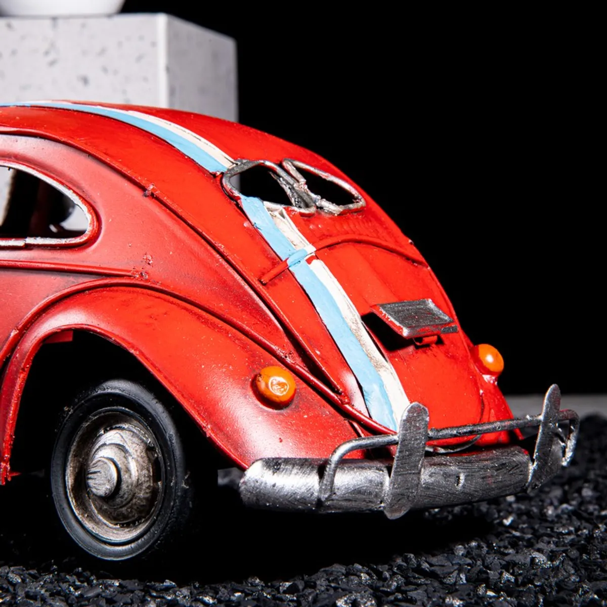 Close-up of the rear detailing on the red metal car showpiece