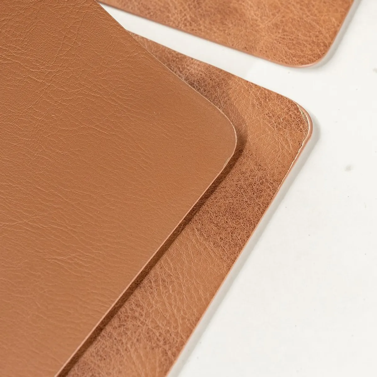 Close-up of brown table mats showing smooth and textured surfaces