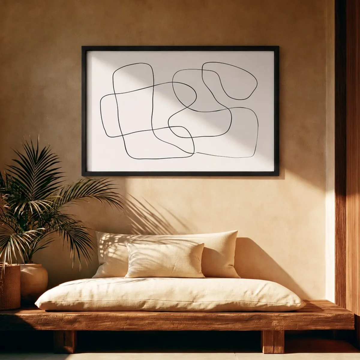 Minimal black and white framed abstract wall painting above a low wooden bed
