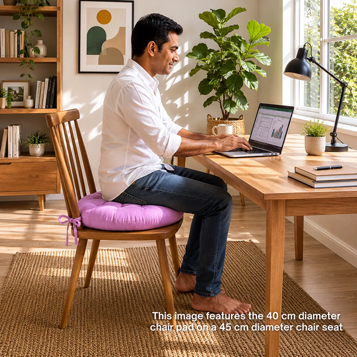Lilac round chair pad placed on a wooden dining chair at a desk