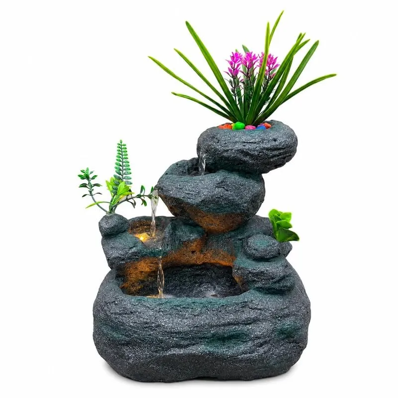 Front view of a grey rock-style tabletop fountain with LED lighting
