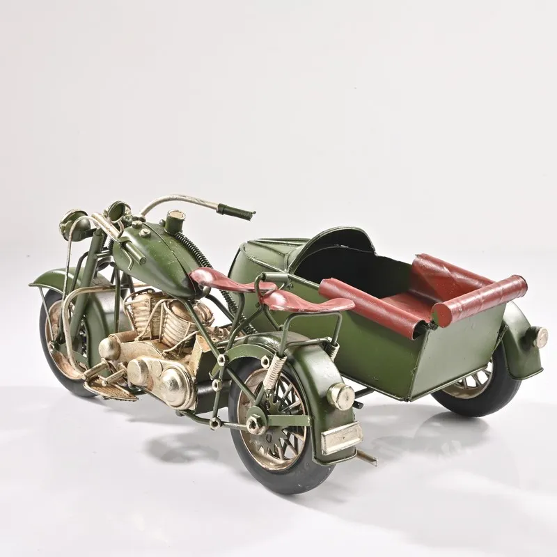 Rear angled view of green motorcycle sidecar showpiece with red seating