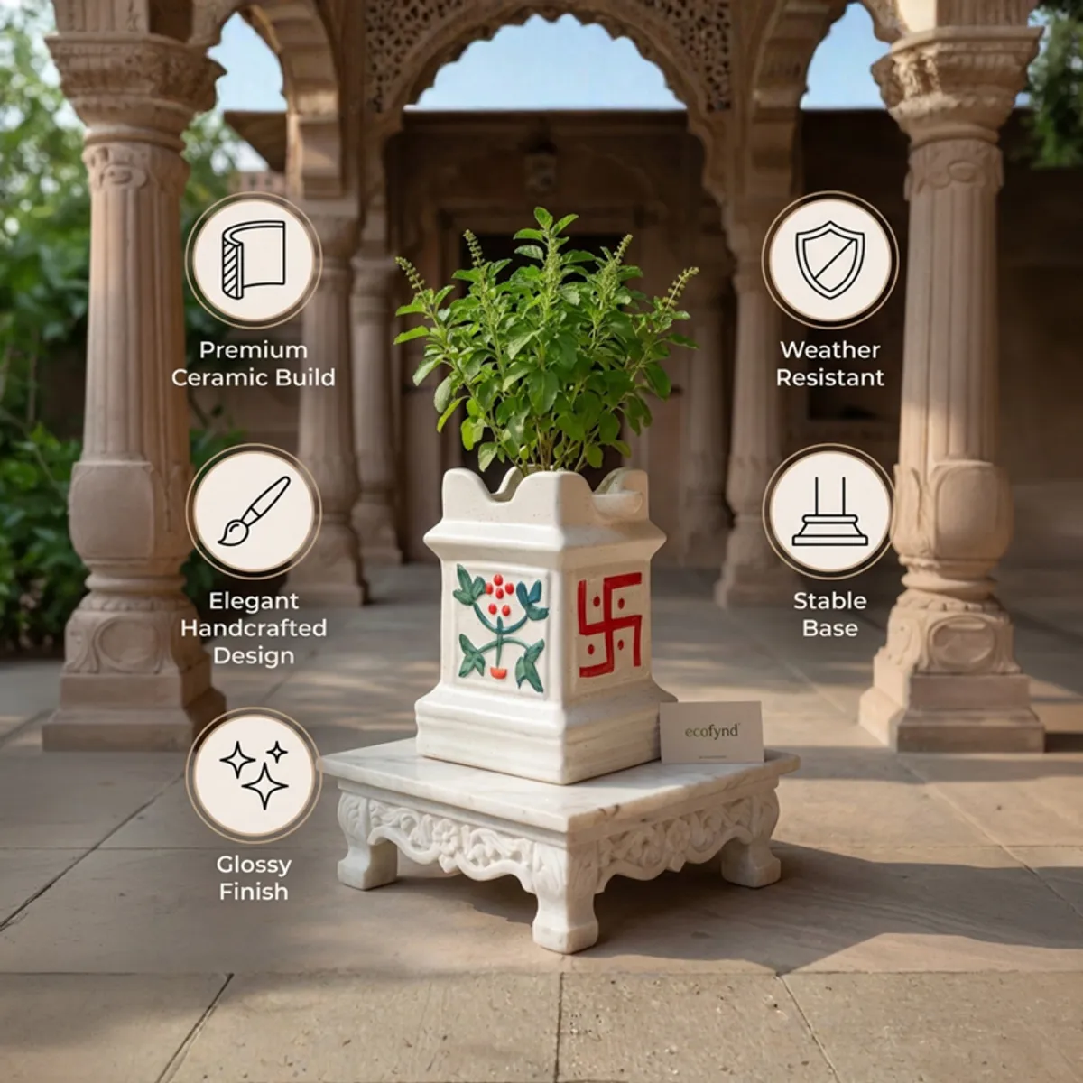 White ceramic planter with botanical and red auspicious motifs in an ornate architectural setting