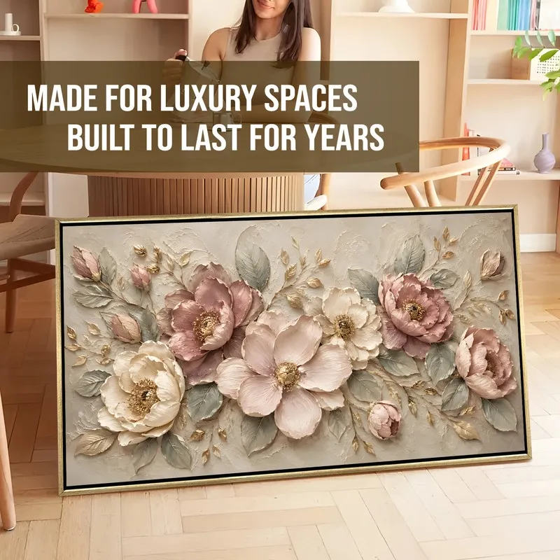 Large framed floral canvas artwork leaning against the floor in a styled room