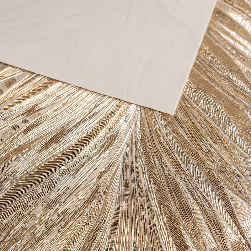 Close-up of metallic palm leaf textured surface on a table mat