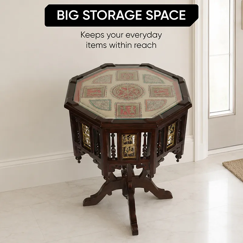 Dark brown octagonal side table with carved base in a room corner