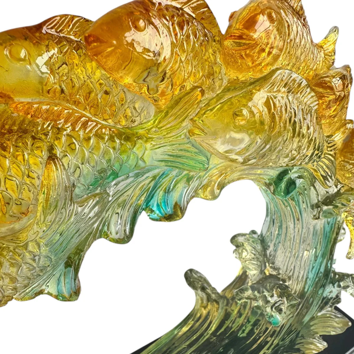 Close-up view of textured golden koi and translucent blue wave