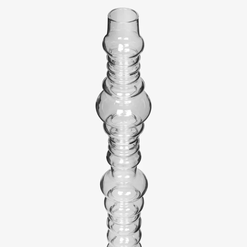 Close-up of the upper section of the clear glass totem lamp