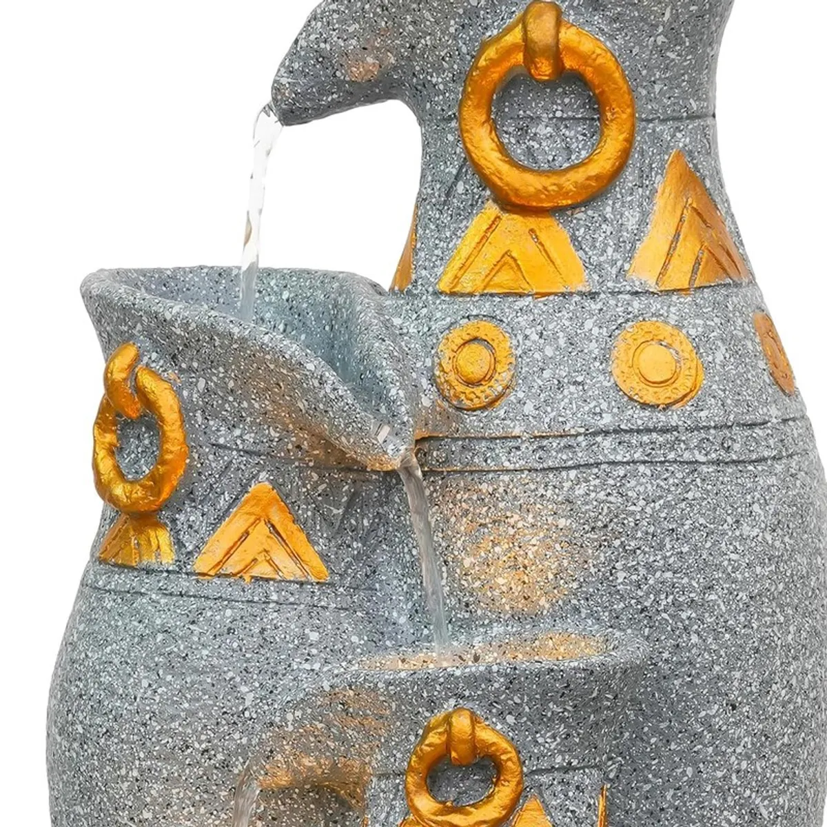 Close-up of the top section of the fountain with water streams and gold motifs.