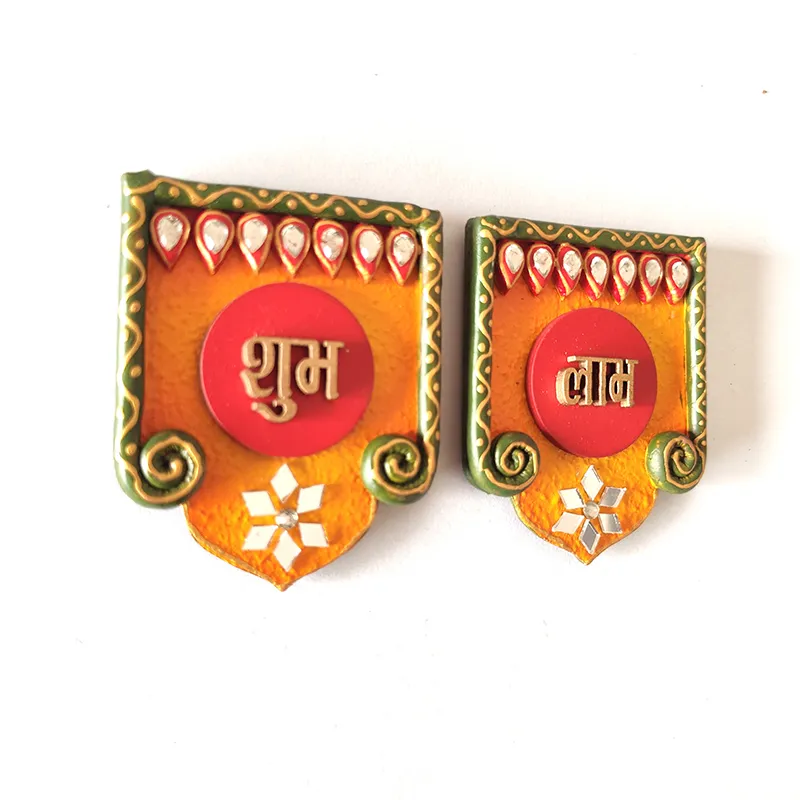 Two Shubh Labh wall accents shown side by side on a white background