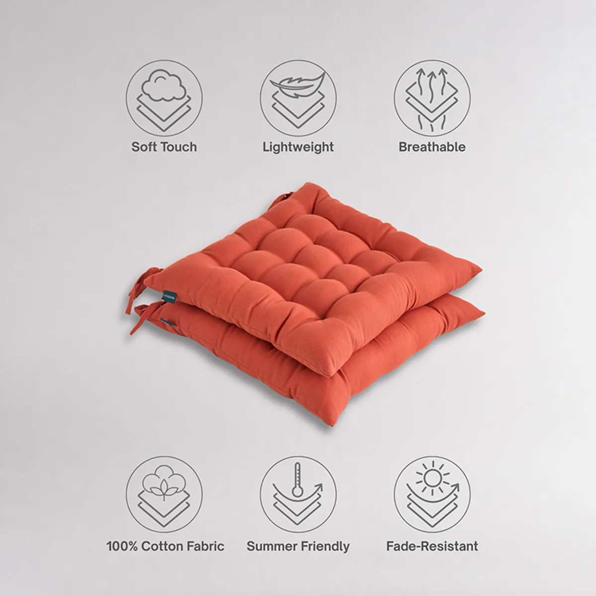 Close-up of orange chair pad fabric and tufted surface