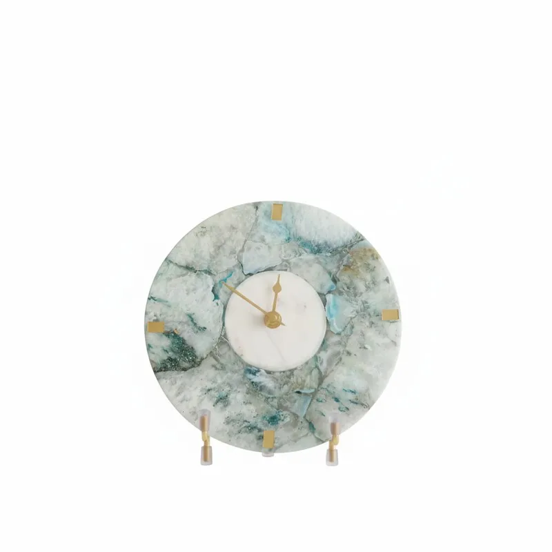 Front view of a round blue and white agate table clock with stand